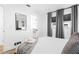 Inviting bedroom showcasing a walk-in closet, soft bedding, and window views at 1311 Cypress Ave, Venice, FL 34285