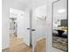 Bright bedroom featuring a walk-in closet, modern mirror, and stylish decor at 1311 Cypress Ave, Venice, FL 34285