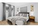 Well-lit bedroom with neutral tones, decorative wall art, and comfortable bedding at 1311 Cypress Ave, Venice, FL 34285