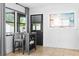 Modern dining area with window views, sleek table, and neutral accents at 1311 Cypress Ave, Venice, FL 34285