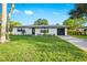 Charming single-story home with well-manicured lawn and driveway at 1311 Cypress Ave, Venice, FL 34285