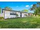 Charming single-story home with well-manicured lawn and driveway at 1311 Cypress Ave, Venice, FL 34285