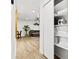 Hallway view showcasing the open floor plan with a glimpse of the living area and storage closet at 1311 Cypress Ave, Venice, FL 34285