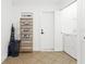 Functional laundry room with tiled floors and washer and dryer ready for use at 1311 Cypress Ave, Venice, FL 34285