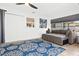 Bright living area with sofa, artwork, tile flooring, and natural light at 1311 Cypress Ave, Venice, FL 34285