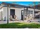 Outdoor patio featuring lounge chairs, pool equipment, and a green lawn at 1311 Cypress Ave, Venice, FL 34285
