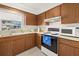 Bright kitchen featuring essential appliances and plenty of storage, perfect for meal prep at 1343 Glendale W Cir # 216, Sarasota, FL 34232