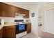 Functional kitchen featuring classic appliances and cabinetry with easy access to adjacent areas at 1343 Glendale W Cir # 216, Sarasota, FL 34232