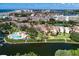 An elevated view of the condo community showing the waterway, docks, pool, and beach at 1500 Cove Ii Pl # 524, Sarasota, FL 34242