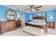 Spacious main bedroom featuring a large dresser, king bed, and stylish furnishings at 1500 Cove Ii Pl # 524, Sarasota, FL 34242