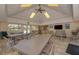 Community clubhouse interior features tile floors, tables, and chairs at 1500 Cove Ii Pl # 524, Sarasota, FL 34242