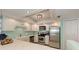 Well-equipped kitchen with stainless appliances, ample countertop space, and bright recessed lighting at 1500 Cove Ii Pl # 524, Sarasota, FL 34242