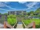 View of the water with dock and a building in the background at 1500 Cove Ii Pl # 524, Sarasota, FL 34242