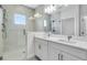 Elegant bathroom with a large walk-in shower, double vanity, and modern fixtures at 1620 Sea Haven Dr # 404, Punta Gorda, FL 33950