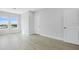 Bright bedroom with two large windows, white trim, and light wood floors at 1620 Sea Haven Dr # 404, Punta Gorda, FL 33950