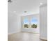 Bright bedroom with two large windows, white trim, and light wood floors at 1620 Sea Haven Dr # 404, Punta Gorda, FL 33950