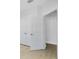 Bedroom showcasing a closet and an doorway with light wood floors at 1620 Sea Haven Dr # 404, Punta Gorda, FL 33950