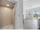 View of an elevator and an open living space with access to a balcony at 1620 Sea Haven Dr # 404, Punta Gorda, FL 33950