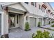 Close up view of a charming three-story townhome with a private garage and walkway at 1620 Sea Haven Dr # 404, Punta Gorda, FL 33950