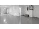 Garage with epoxy flooring and a door leading to the backyard at 1620 Sea Haven Dr # 404, Punta Gorda, FL 33950