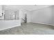 Bright open-concept living space featuring wood-look tile flooring and abundant natural light at 1620 Sea Haven Dr # 404, Punta Gorda, FL 33950