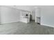 Bright open-concept living space featuring wood-look tile flooring and abundant natural light at 1620 Sea Haven Dr # 404, Punta Gorda, FL 33950