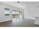 Open-concept living room featuring ample natural light, sliding glass doors, and modern flooring at 1620 Sea Haven Dr # 404, Punta Gorda, FL 33950