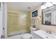 Bright bathroom with a tub and shower combo, and a white vanity with a mirror at 1759 Lake Pl # 1759-B, Venice, FL 34293
