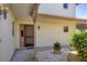 Inviting entrance way surrounded by rock and lush foliage at 1759 Lake Pl # 1759-B, Venice, FL 34293