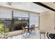 Enclosed lanai with tile flooring and windows overlooking a tranquil canal and lush landscaping at 1759 Lake Pl # 1759-B, Venice, FL 34293