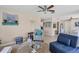 Comfortable living room with tile floors and neutral paint at 1759 Lake Pl # 1759-B, Venice, FL 34293