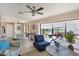 Spacious living room open to screened patio and dining area at 1759 Lake Pl # 1759-B, Venice, FL 34293