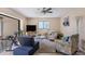 Cozy living room with natural light and views of screened patio at 1759 Lake Pl # 1759-B, Venice, FL 34293