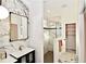 Modern bathroom features marble walls and floors, a glass-enclosed shower, and a stylish vanity at 17817 Woodland Ct, Punta Gorda, FL 33982