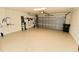 Spacious two-car garage with ample storage space and clean, epoxy-coated flooring at 17817 Woodland Ct, Punta Gorda, FL 33982