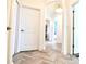 Charming hallway features neutral décor, wood floors and arched openings at 17817 Woodland Ct, Punta Gorda, FL 33982