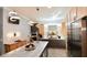 Modern kitchen with stainless steel appliances, mosaic backsplash and decorative lighting at 17817 Woodland Ct, Punta Gorda, FL 33982