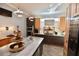 Modern kitchen with stainless steel appliances, mosaic backsplash and decorative lighting at 17817 Woodland Ct, Punta Gorda, FL 33982