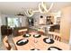 Open-concept living space features a dining area, living room, and kitchen with modern decor and finishes at 17817 Woodland Ct, Punta Gorda, FL 33982