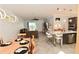 Open-concept living space features a dining area, living room, and kitchen with modern decor and finishes at 17817 Woodland Ct, Punta Gorda, FL 33982