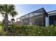 Enclosed screened-in patio, providing a relaxing outdoor living space with lush landscaping and privacy at 17817 Woodland Ct, Punta Gorda, FL 33982
