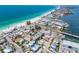 Gorgeous aerial view of a coastal neighborhood with beachfront access and vibrant turquoise waters at 205 Highland Ave # 2, Bradenton Beach, FL 34217