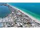 Stunning aerial shot of a coastal community showcasing beachfront access and beautiful blue ocean waters at 205 Highland Ave # 2, Bradenton Beach, FL 34217