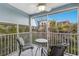 Relaxing screened balcony with comfortable seating overlooking lush tropical landscaping at 205 Highland Ave # 2, Bradenton Beach, FL 34217