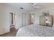 Comfortable bedroom featuring wood floors, closet, and access to the bathroom and kitchen at 205 Highland Ave # 2, Bradenton Beach, FL 34217