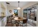 Cozy dining area with seating for four and a view of the screened patio, perfect for casual meals at 205 Highland Ave # 2, Bradenton Beach, FL 34217