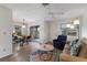Open-concept living area with dining space and access to the screened patio for outdoor enjoyment at 205 Highland Ave # 2, Bradenton Beach, FL 34217
