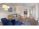 Bright living room features cozy seating, beach-themed decor, and plenty of natural light at 205 Highland Ave # 2, Bradenton Beach, FL 34217
