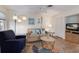 Inviting living room with comfortable seating, a ceiling fan, and a television for entertainment at 205 Highland Ave # 2, Bradenton Beach, FL 34217