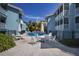 Relaxing pool area with lounge chairs and tables, perfect for enjoying sunny days in paradise at 205 Highland Ave # 2, Bradenton Beach, FL 34217